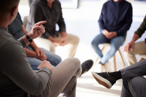 Foto: Group therapy, psychology and hands for mental health